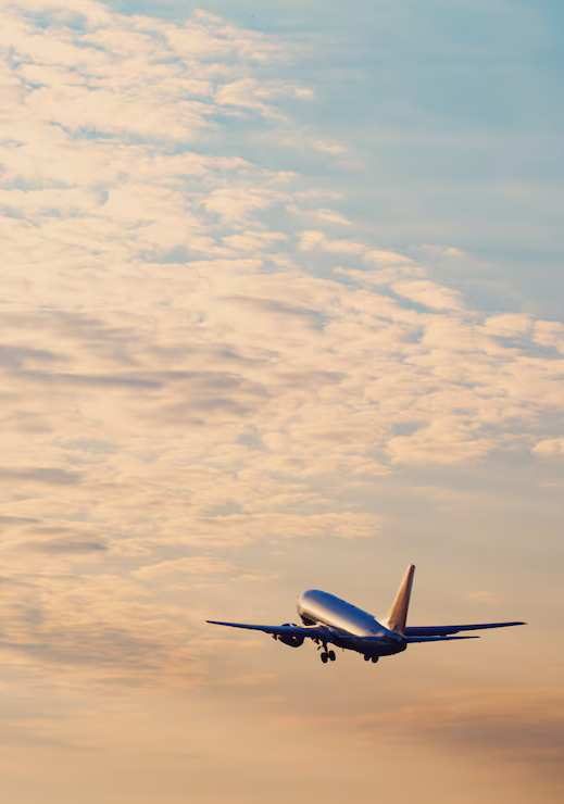 airplane-in-sunset-sky airplane-in-sunset-sky